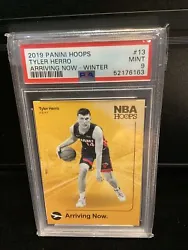 This 2019 Panini NBA Hoops Tyler Herro Rookie Arriving Now #13 PSA 9 trading card is a must-have for any true...