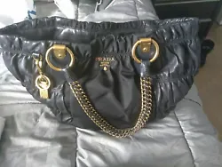 Prada bag . Purchased from Prada store in NYC in 2011. Very good condition. Comes with a duffle bag Gold details ....