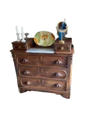 This is a classic Victorian style dresser, with beautiful oak and walnut veneer. The wood grains on it are beautiful....