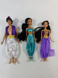 Disney Aladdin Barbies Two Jasmine One Aladdin Original Clothes. Two dolls (Aladdin and one Jasmine) are missing shoes,...