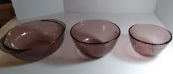 This set of three Pyrex nesting bowls in amethyst color is a vintage piece that is sure to add character to any...