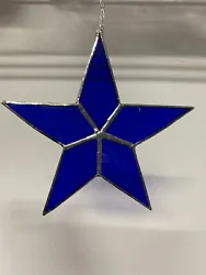 New Stained Glass Star Suncatcher is made with smooth cathedral blue glass and is 6” tall by 6” wide. It includes...