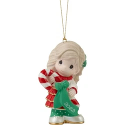 Item # 231002. Dressed in her festive Christmas attire with golden trim, this cutie holds a giant candy cane bearing a...