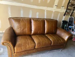 **Showroom Condition - Italian Distressed Leather - Traditional sofa with rolled arms** The Butler Sofa is 91” Wide....