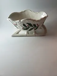 This vintage porcelain candy dish depicts a charming Santa Claus and sleigh design, perfect for adding a festive touch...