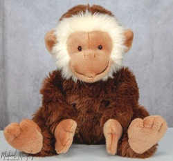 “Mickey” is very furry, with a brown plush body, tan head, feet, and hands, and white fur surrounding his face. He...
