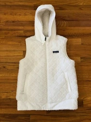 Style No. 25221. This reversible, hooded vest is made with toasty-warm fleece in a diamond-quilt pattern on one side...