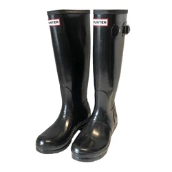 Hunter glossy black tall rubber pull on rain boots, size 7, has a few marks on the outside but are in good preowned...