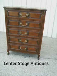 It has dovetailed drawers and raised paneled sides. The side has a small hairline crack where the wood dried as per...