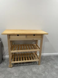 Bitch wood kitchen island cart. 2 level storage and 2 full drawers. Minimum usage 4 months, wheels on 1 side for easy...
