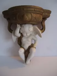 As shown, this is an Ardalt china (bisque/porcelain) winged cherub wall shelf. Has label on rear and is stamped #7558....