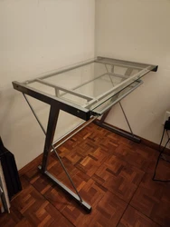 Includes glass desk with computer keyboard tray.  Also includes a corner attachment and an additional extension deal...