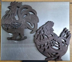 This decorative Kitchen Trivet Set of 2 is perfect functional farm decor for your kitchen! The cast iron trivets are in...