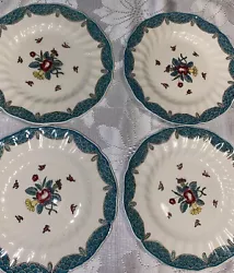 Enhance your dining experience with this exquisite set of four dessert plates from Royal Doulton. Featuring the elegant...