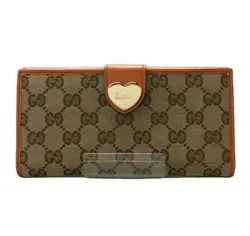 This is an authentic Gucci long wallet with the iconic GG pattern in brown leather and canvas. It features a beautiful...