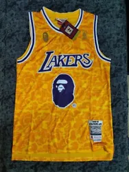 Show off your love for the Los Angeles Lakers and the legendary Kobe Bryant with this Bape x Mitchell & Ness Mens...