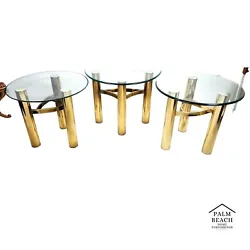 3 Piece Set of MCM Tubular Brass Tables. Most of the very dark areas in the photos are reflections. Includes 2 round...