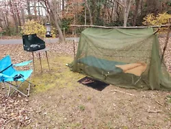 Includes vintage aluminum folding cot, the blue foam pad, sleeping bag, colman light, and works perfect but needs two 6...