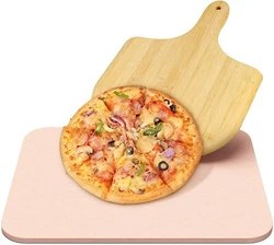Use the pizza spatula to transfer the carefully made pizza to the stone. Once the crust is brown, remove the pizza from...