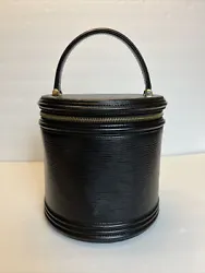 Cute round black bag / purse. LV logo impressed on front.
