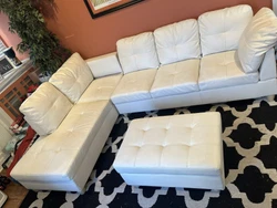 Sectional couch. Stylish, sleek, modern sectional and ottoman for sale. It comes in two pieces for easy transport. Must...