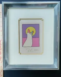 Here for sale is a authentic Peter Max numbered 174/300 and signed lithograph featuring a woman holding a bird facing...