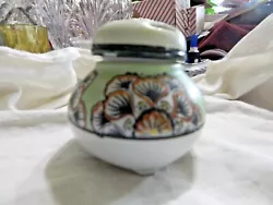Incense burner in a ginger jar shape with removeable cover. painted with abstract lotus leaves and flowers. mint green...