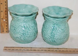 This is a good size pot to grow miniature violets in. These pots are self-watering pots. The bottom half of the insert...