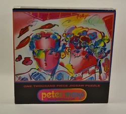 This 1999 Peter Max Puzzle by CEACO is previously owned but never opened. It remains sealed. PETER MAX 1000 piece NOS...