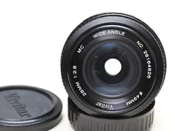 Vivitar 28mm f/2.8 manual focus wide angle lens. Focusing is smooth and even. The lens is in good used condition.