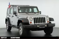 This 2009 Jeep Wrangler Unlimited X features the bright silver metallic clear coat exterior and dark slate gray/medium...