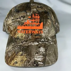 Realtree Camo hat with an orange Wayerways boat on the front. The back is adjustable.
