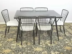 As if the 6 matching chairs are not enough wait until you see the wonderful blue-gray Formica table! We just love this...