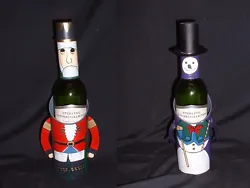 It includes one NUT CRACKER & one SNOWMAN. NEW CHRISTMAS WINE BOTTLE HOLDERS -. GREAT CHRISTMAS GIFTS! I have several...