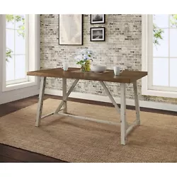 This dining table brings a contemporary twist to rustic construction. This stylish table combines provincial and...