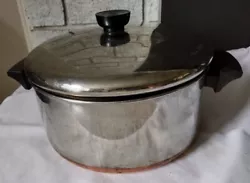 1801 Revere Ware 4 1/2 quart pot with lid copper bottom. This pan definitely shows wear and use.