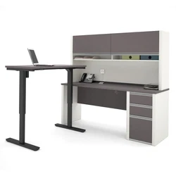 The L-Desk features an impact resistant PVC edge, classic moldings and a modesty panel on the credenza. Drawers on...