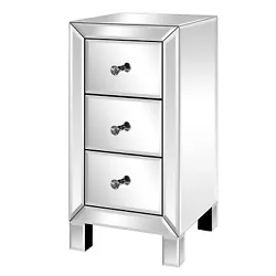 This unique mirrored nightstand or bedside table with three drawers is sure to add sparkle to your bedroom. The...