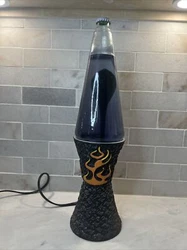 The lava inside is a black gray color. The lava seems to move slow and the light from the bottom does not shine through...