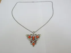 SILVER COLOURED CHAIN NECKLACE WITH A BUTTERFLY AND FLOWERS SHAPED PENDANT. 24 INCHES LONG. 