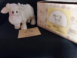 Precious Moments “Cow With Bell And Blue Bird “ # E-5638.  PERFECT CONDITION. ALWAYS KEPT IN GLASS DISPLAY CASE....