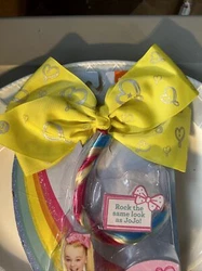 Featuring a bright yellow color and rainbow hair accents, this bow is perfect for any JoJo Siwa fan. Made by Just Play,...