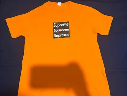 This Supreme T-Shirt in size L features a vibrant orange color with the iconic Box Logo and Accents showcasing the...
