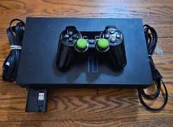 Sony PlayStation 2 Console in sleek black color. It is compatible with NTSC-U/C (US/Canada) region codes, making it...