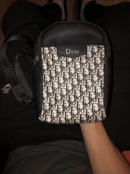This exquisite Dior bag is a must-have for any stylish woman out there. The sleek design and high-quality craftsmanship...