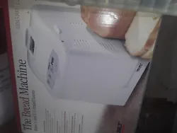 bread maker machine new in box, white, programable, makes 1 1/2 pound loaves.