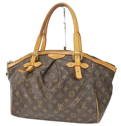 LOUIS VUITTON Tivoli GM. Louis Vuitton Monogram Canvas and leather. Ring to attach with pouch. Two inside open pockets...