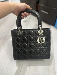 Authentic Lady Dior Medium size in black silver hardware with sling. Preowned in very good condition. No rubbings on...
