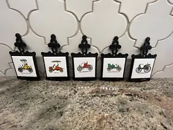 5 Vintage Cars Cast Iron Tile Trivets Wall Hangings Home Decor. Condition is Used. Shipped with USPS Priority Mail.
