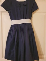 This beautiful navy dress is perfect for any special occasion such as parties, weddings or church. The dress is a size...